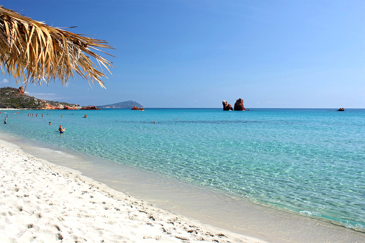 Cea Beach, with the two red porphyry stacks in the background, Is Scoglius Arrubius