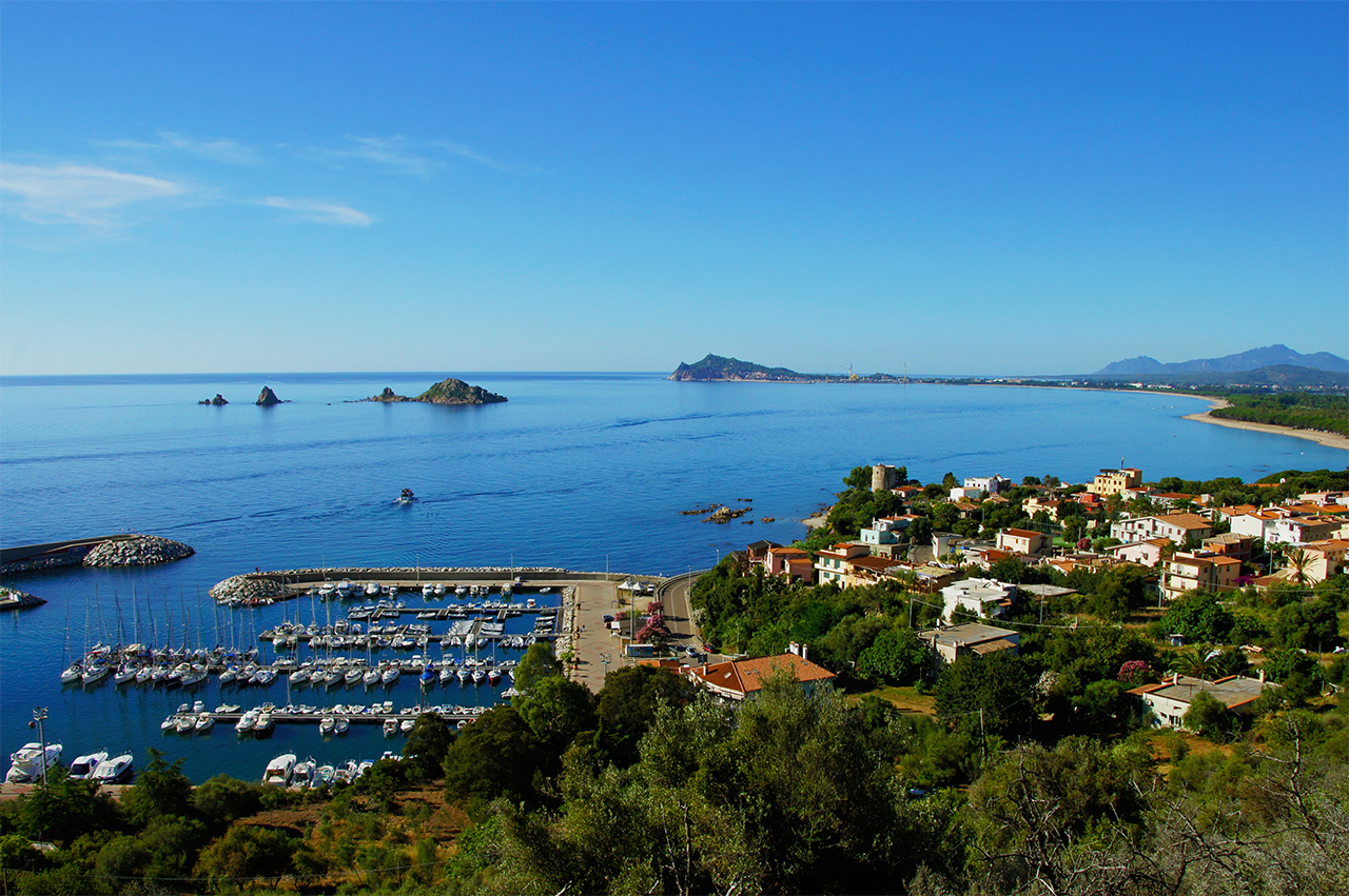 Port of Santa Maria Navarrese with the small island of Ogliastra in the background Port of Santa Maria Navarrese with the small island of Ogliastra in the background
