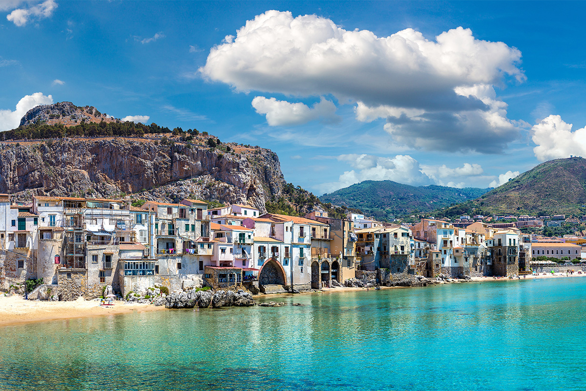 Famous Cefalu beach, nestled between the houses