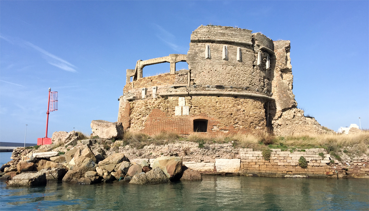 Fort St. Peter in Molo del Lazzaretto with the 3 papal coats of arms visible on the façade